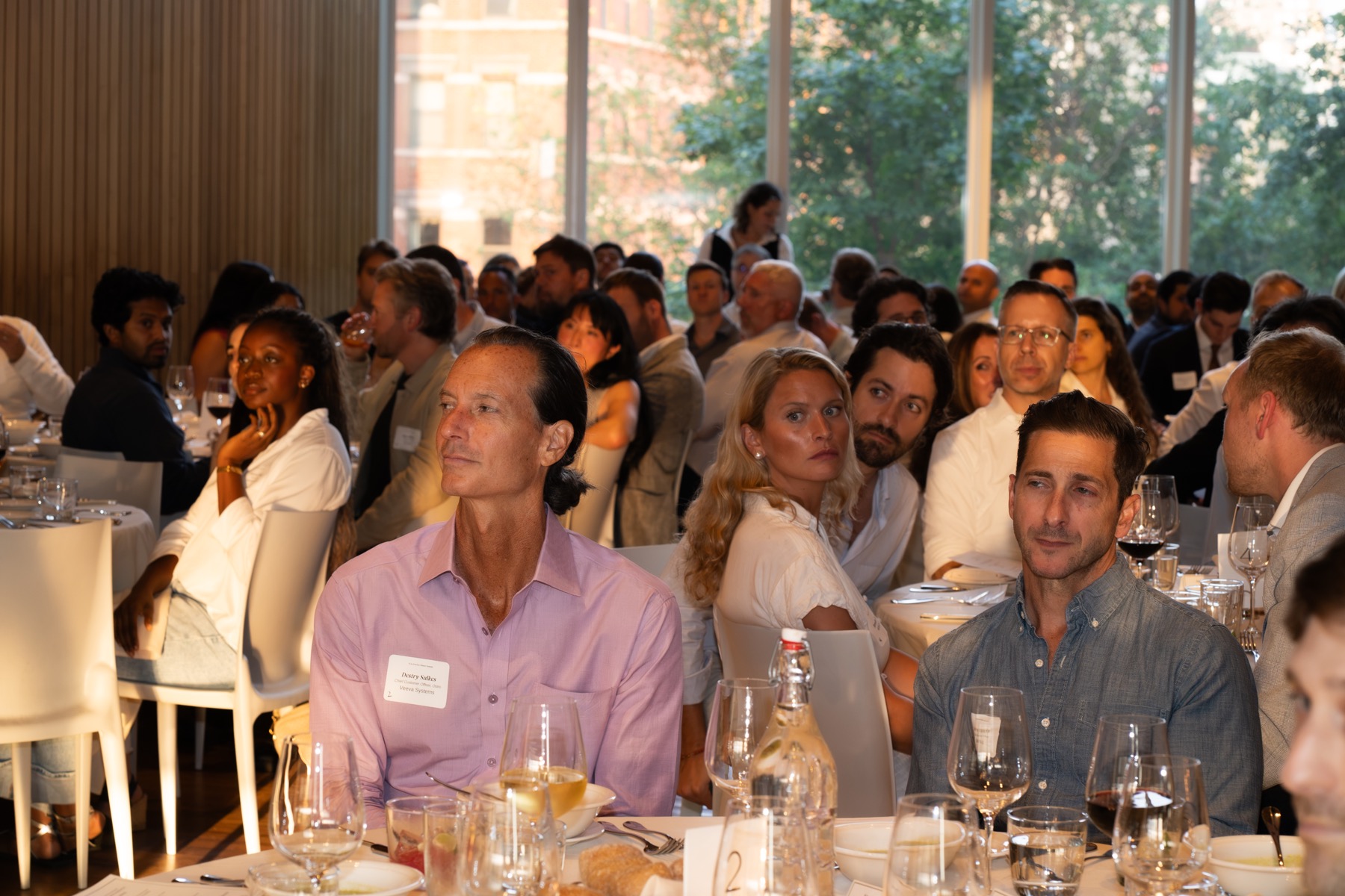 Attendees watching a live event program