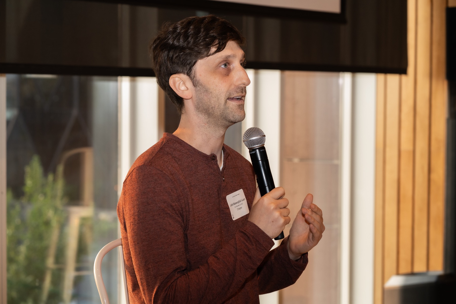 Speaker presenting with a microphone during an event