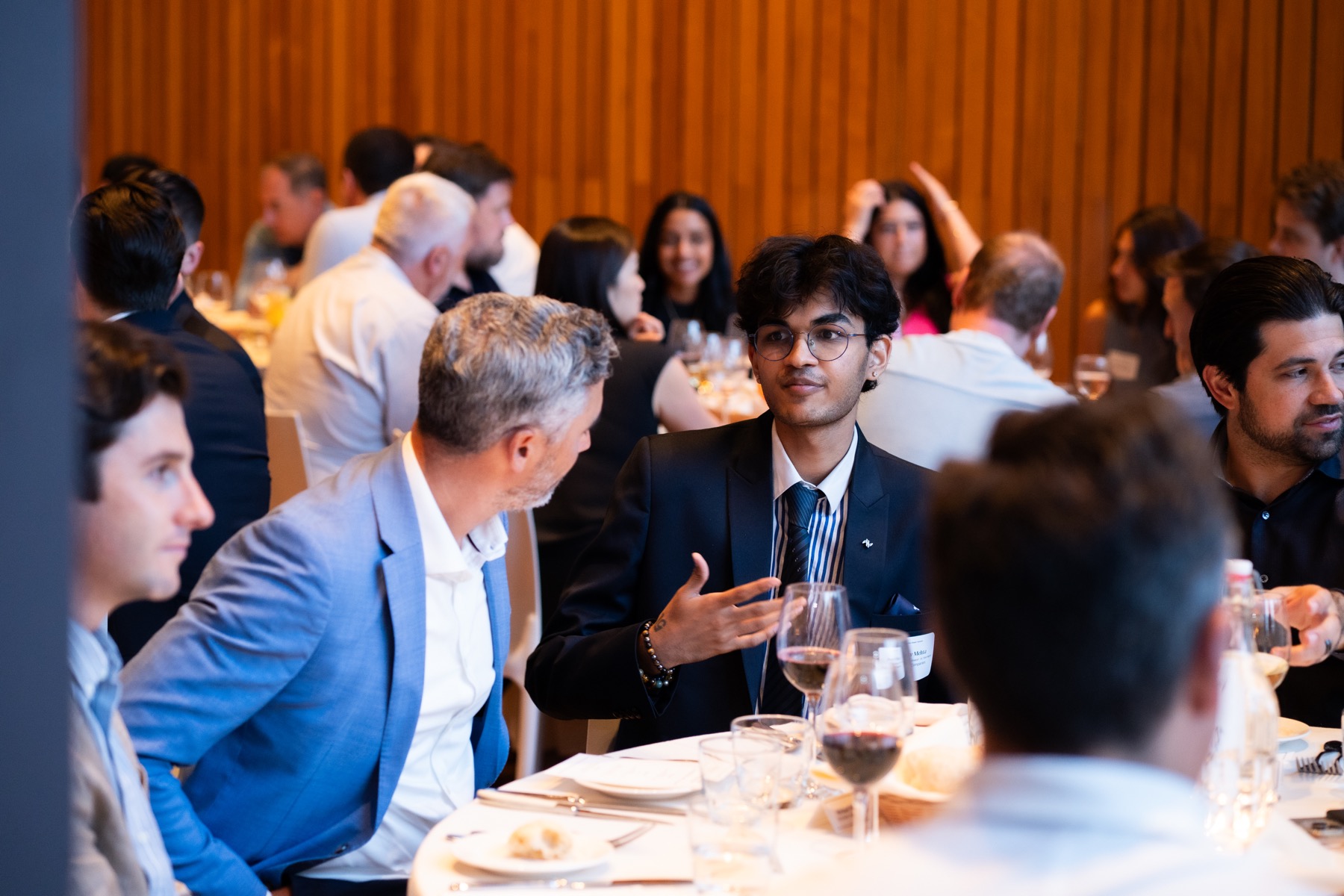 Professional guests networking during an event dinner