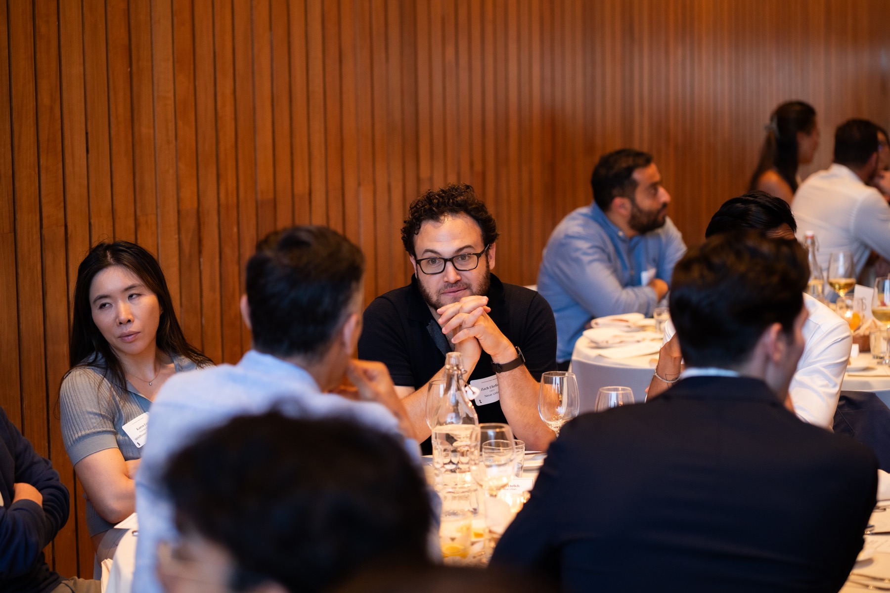Event guests seated around a dinner table